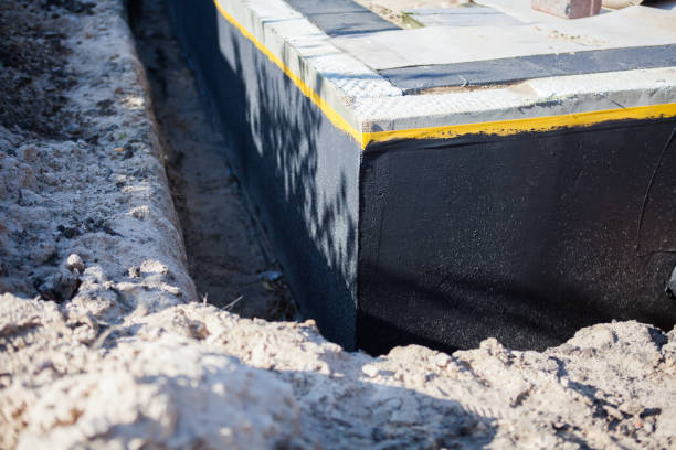 Professional Basement Waterproofing technician working in Fairport, NY